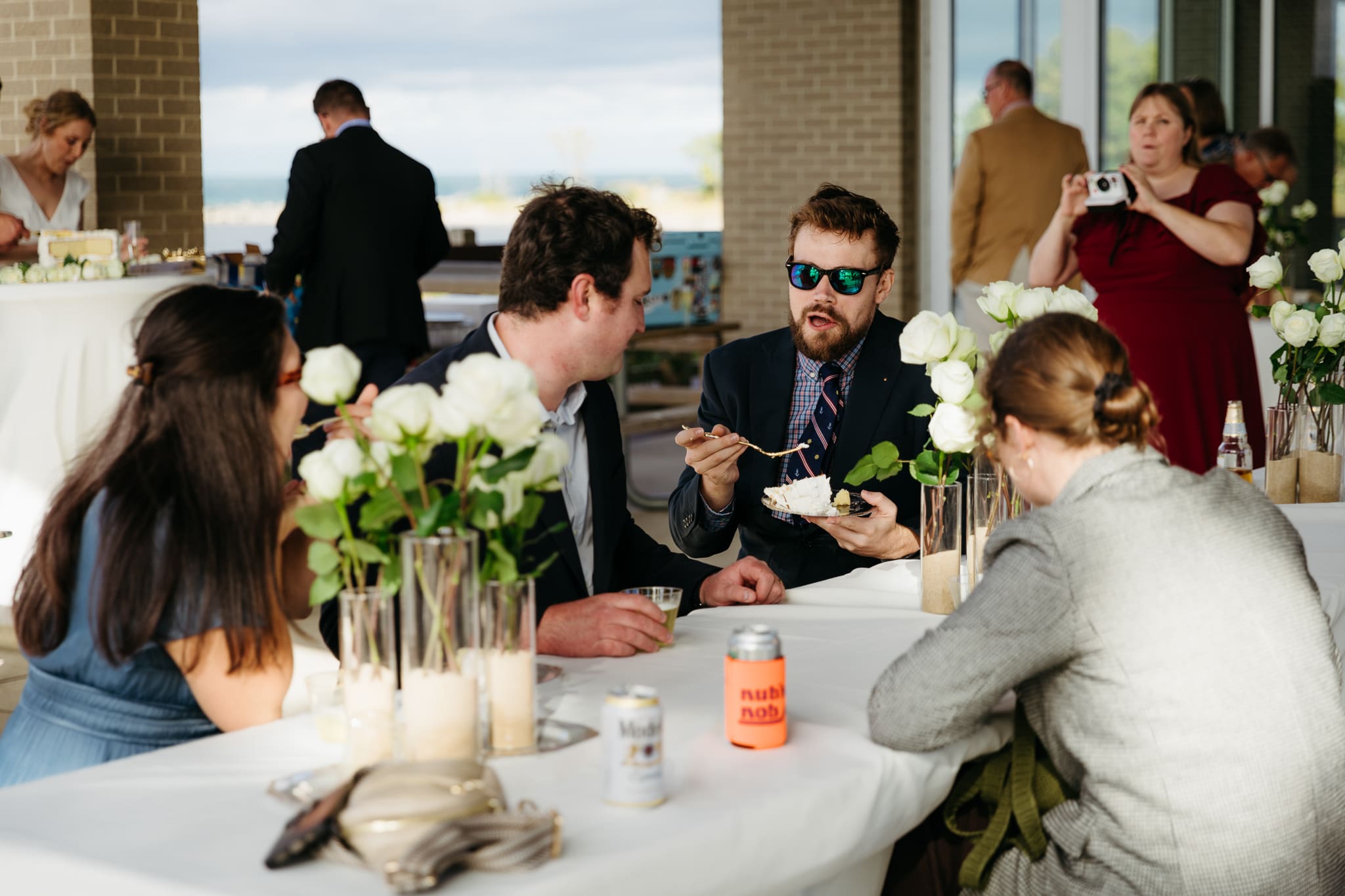 Family and friends hanging out and celebrating during a wedding at Indiana Dunes