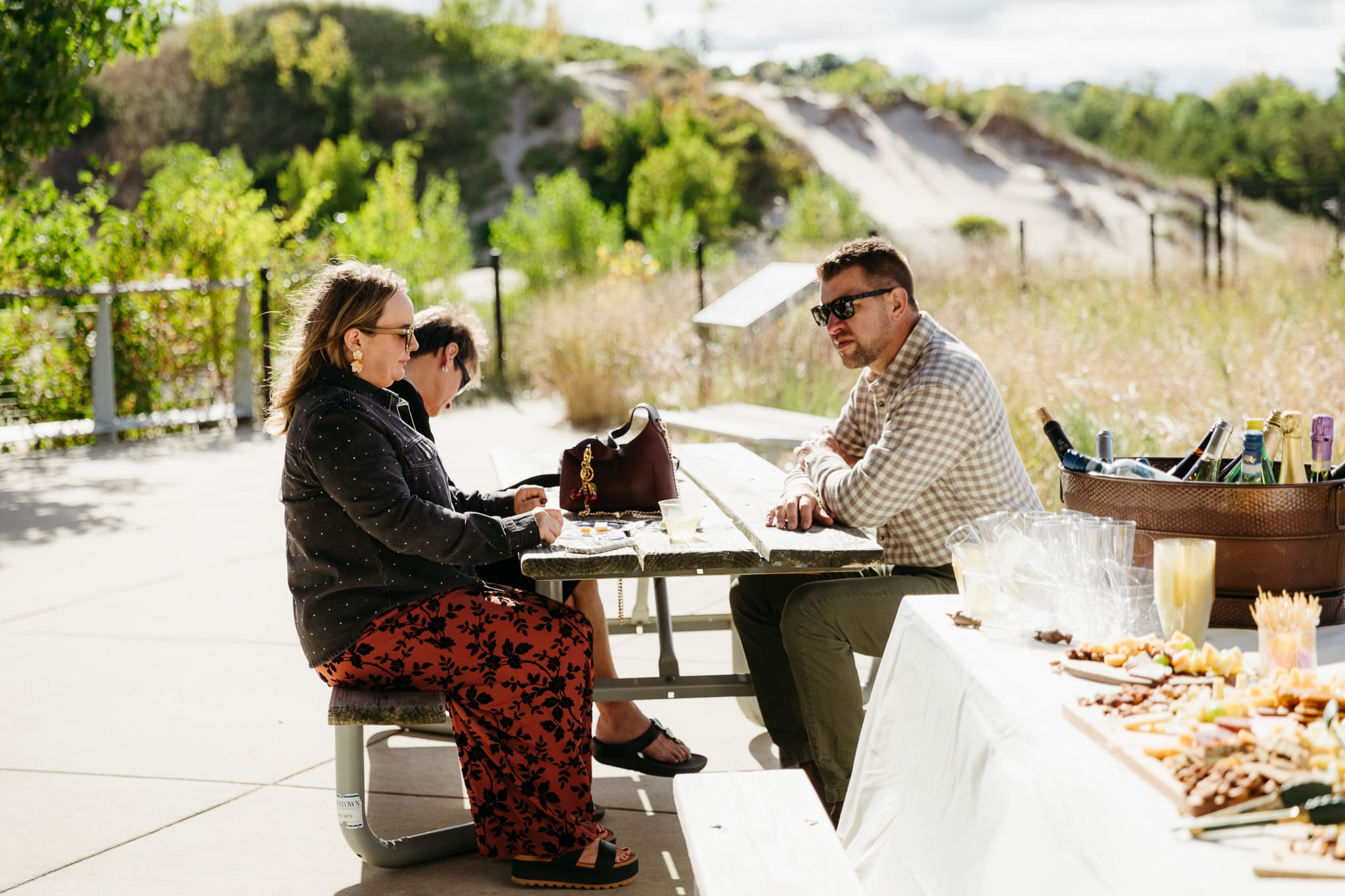 Family and friends hanging out and celebrating during a wedding at Indiana Dunes