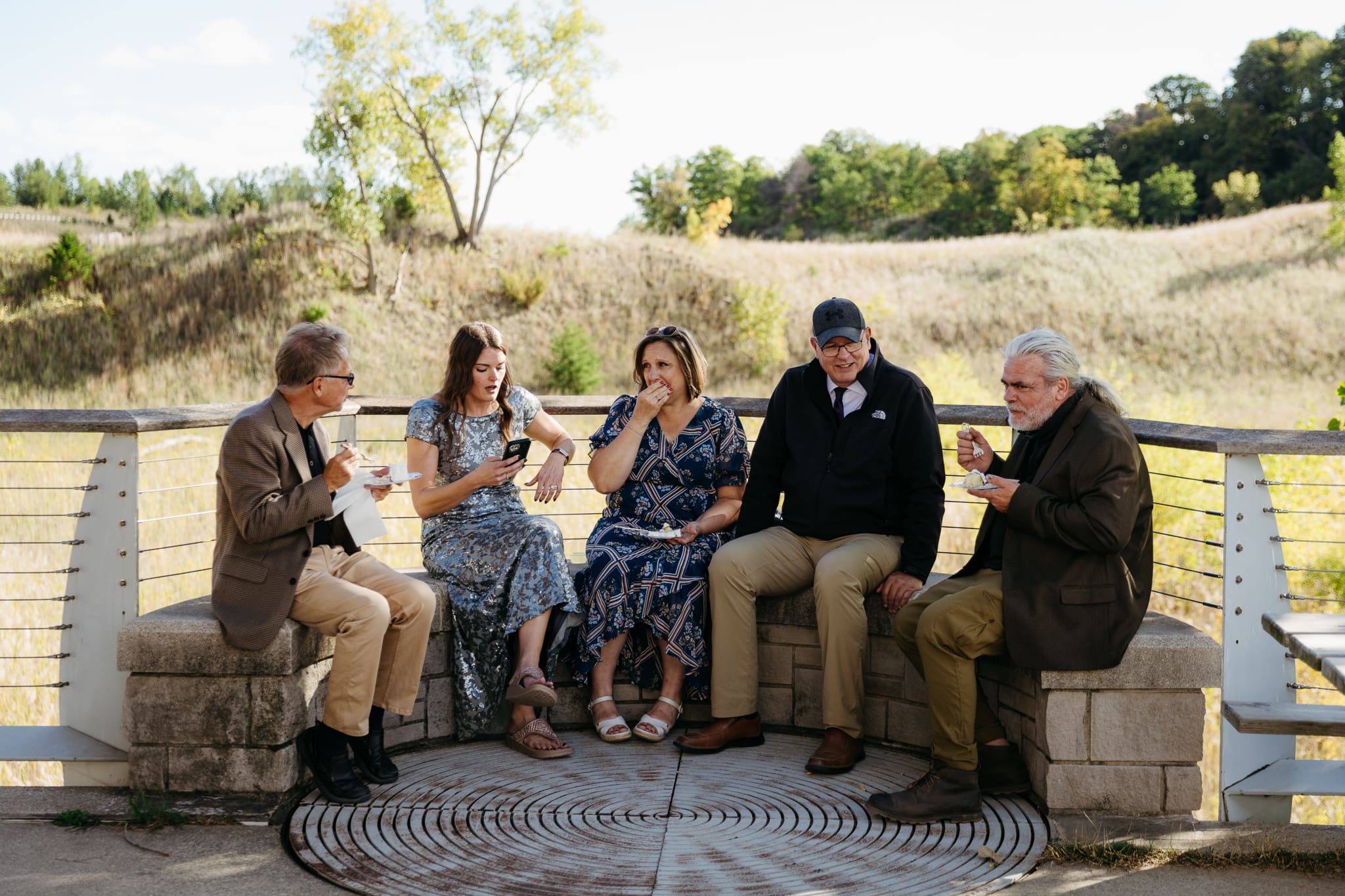 Family and friends hanging out and celebrating during a wedding at Indiana Dunes