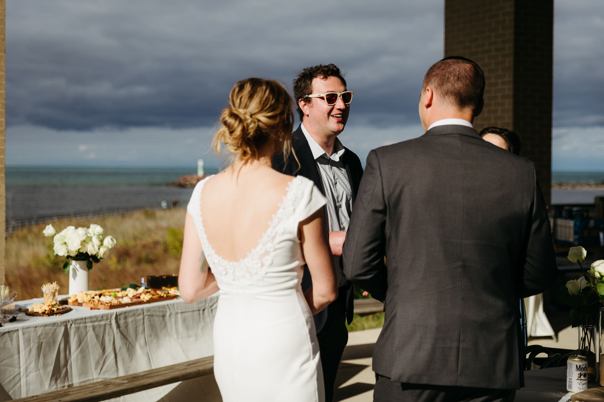 Family and friends hanging out and celebrating during a wedding at Indiana Dunes