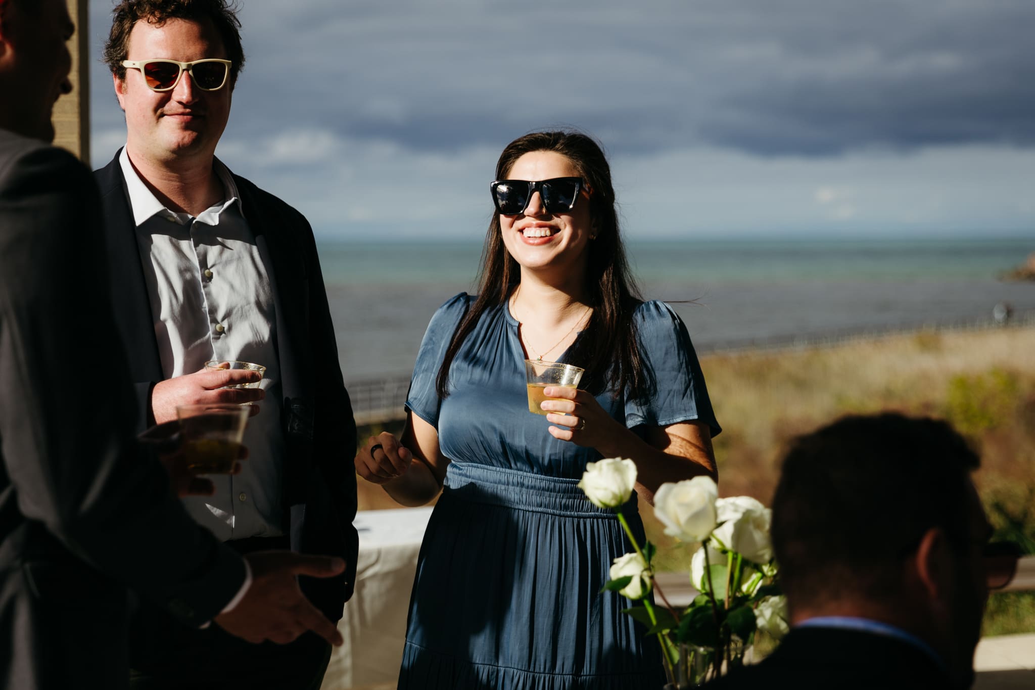 Family and friends hanging out and celebrating during a wedding at Indiana Dunes