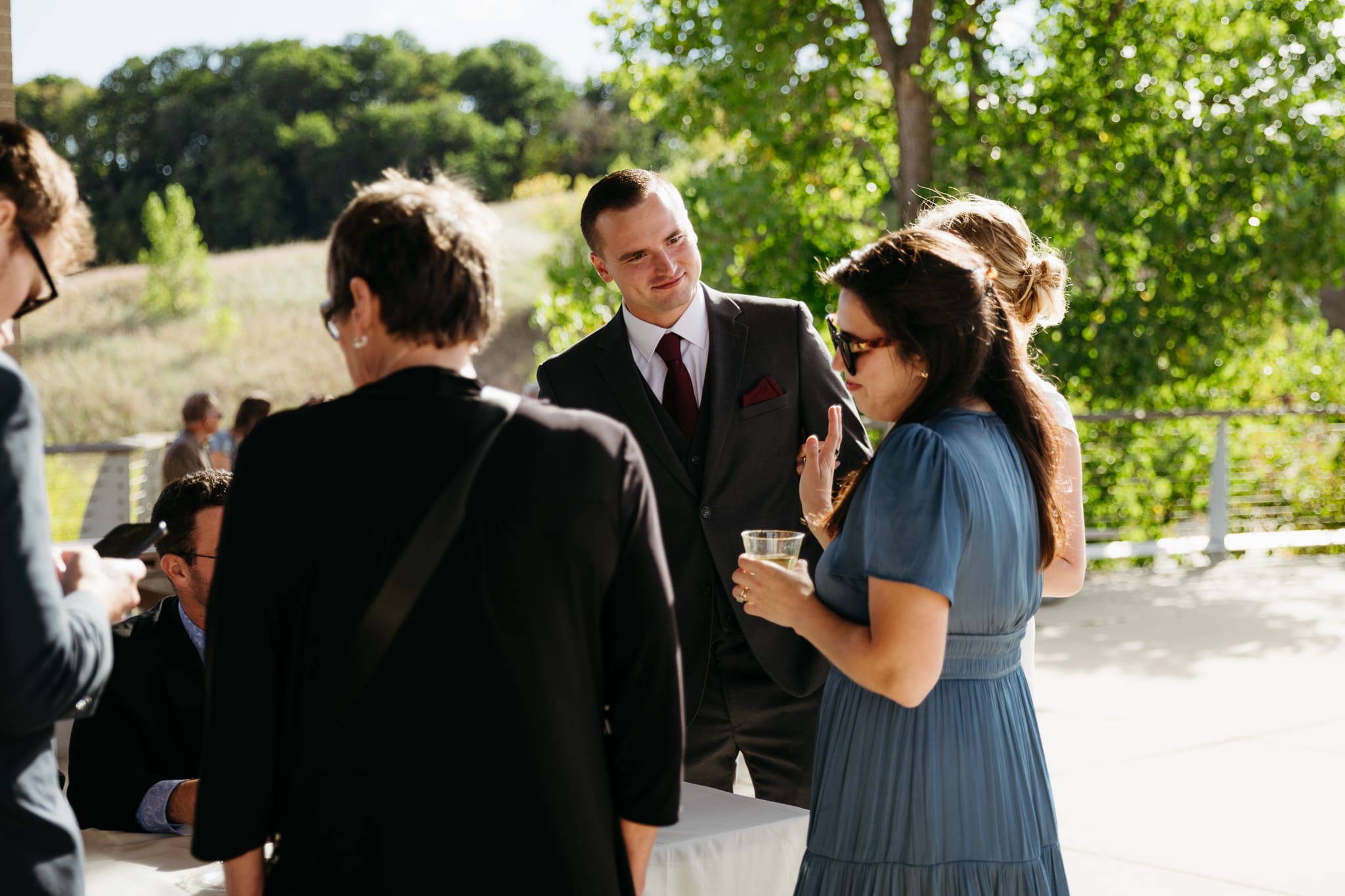 Family and friends hanging out and celebrating during a wedding at Indiana Dunes