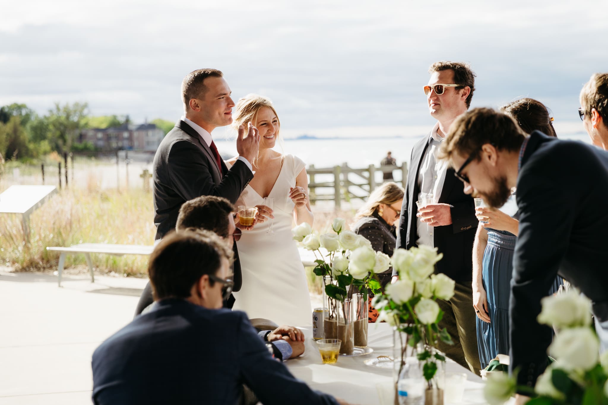 Family and friends hanging out and celebrating during a wedding at Indiana Dunes