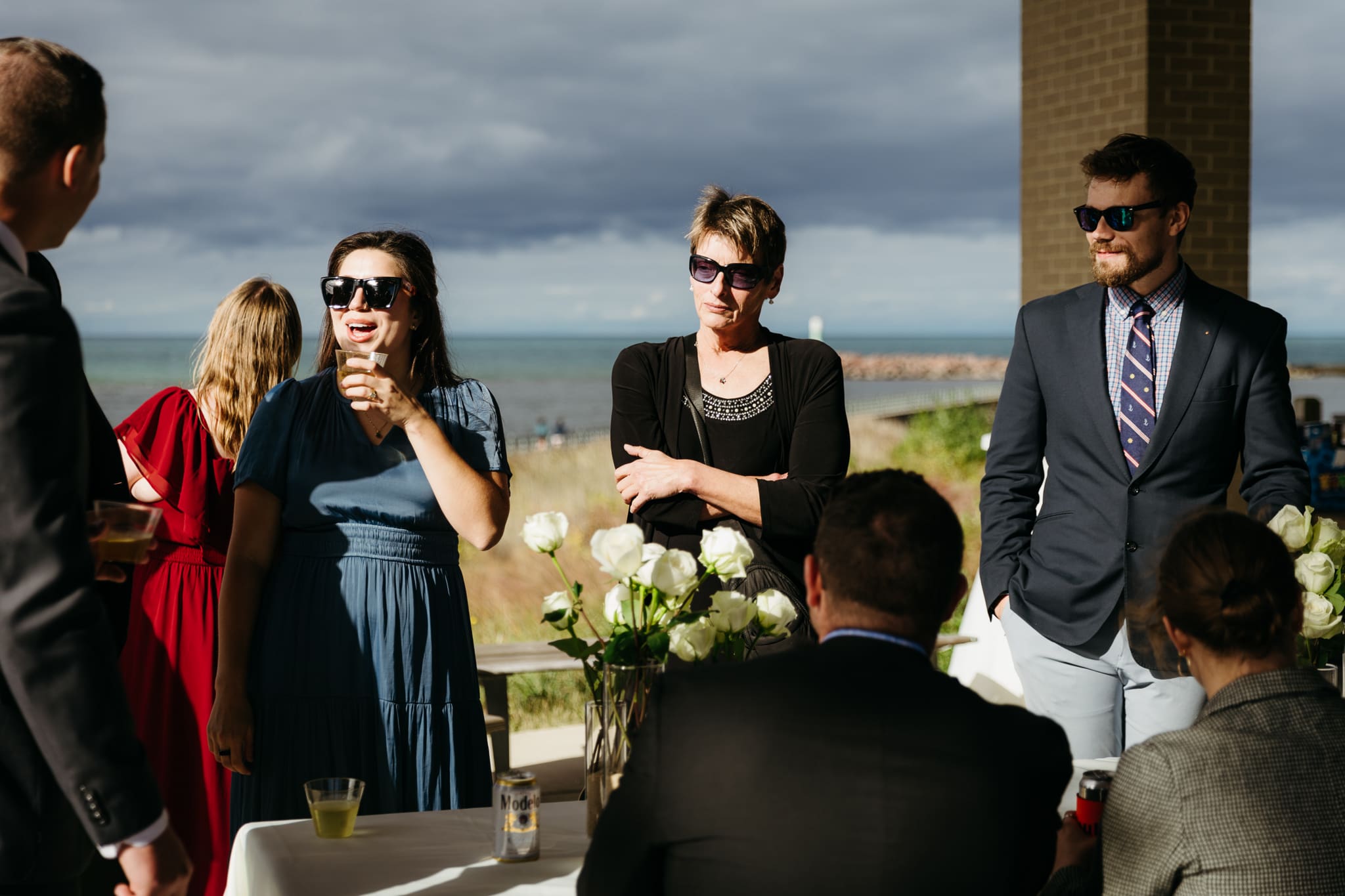 Family and friends hanging out and celebrating during a wedding at Indiana Dunes