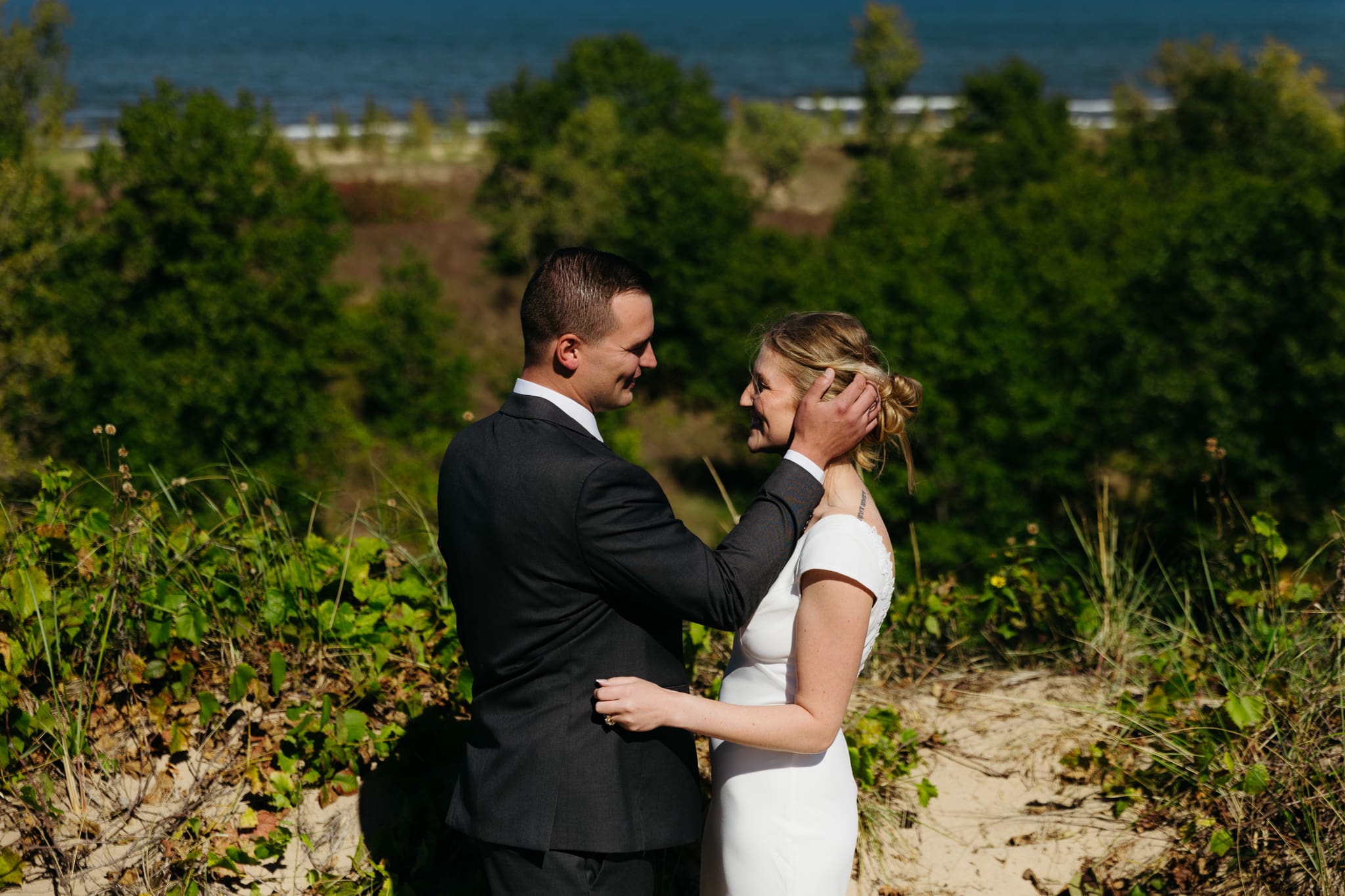 Bride and groom explore the dunes of Indiana Dunes National park during their intimate beach wedding
