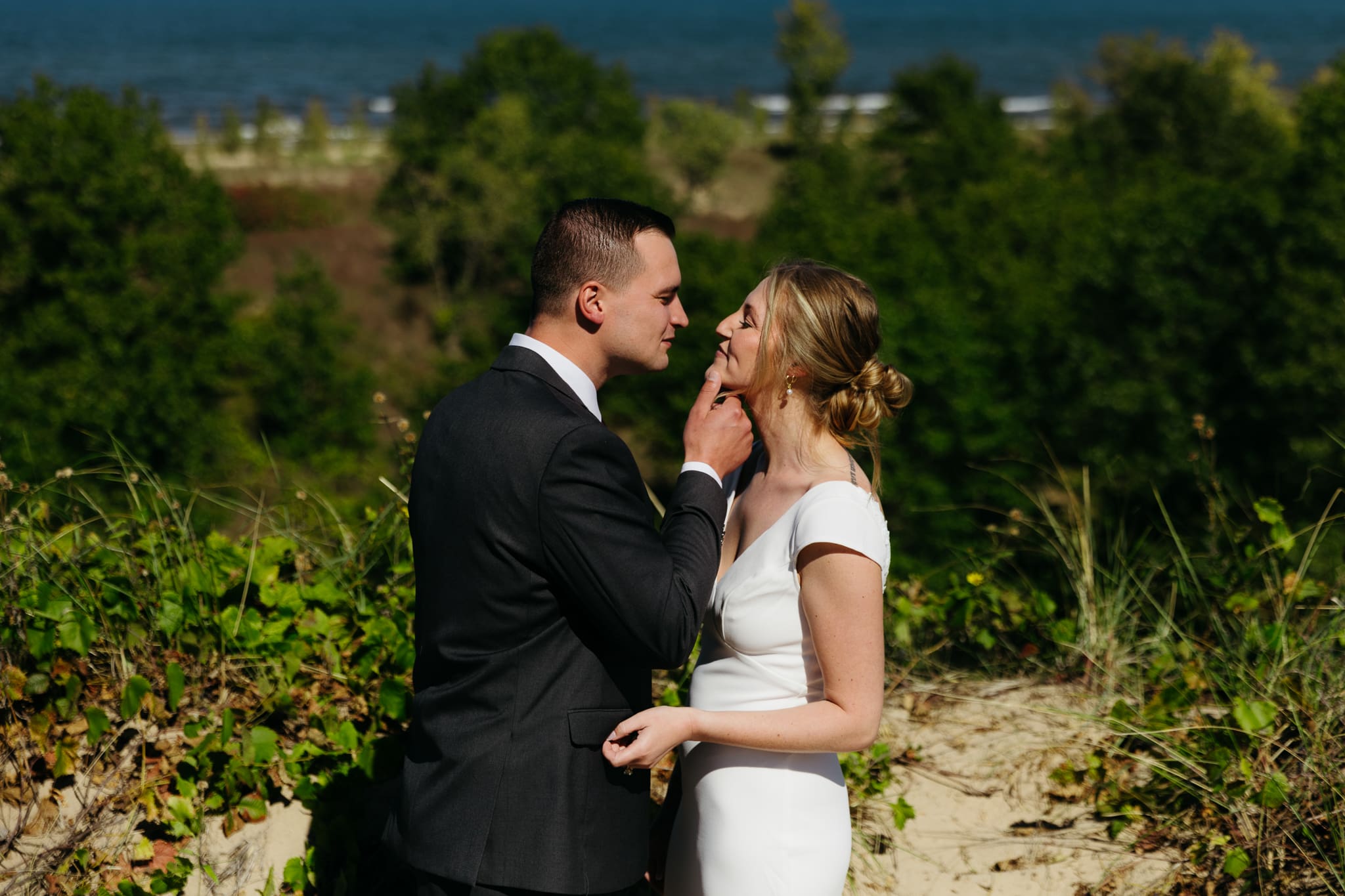 Bride and groom explore the dunes of Indiana Dunes National park during their intimate beach wedding