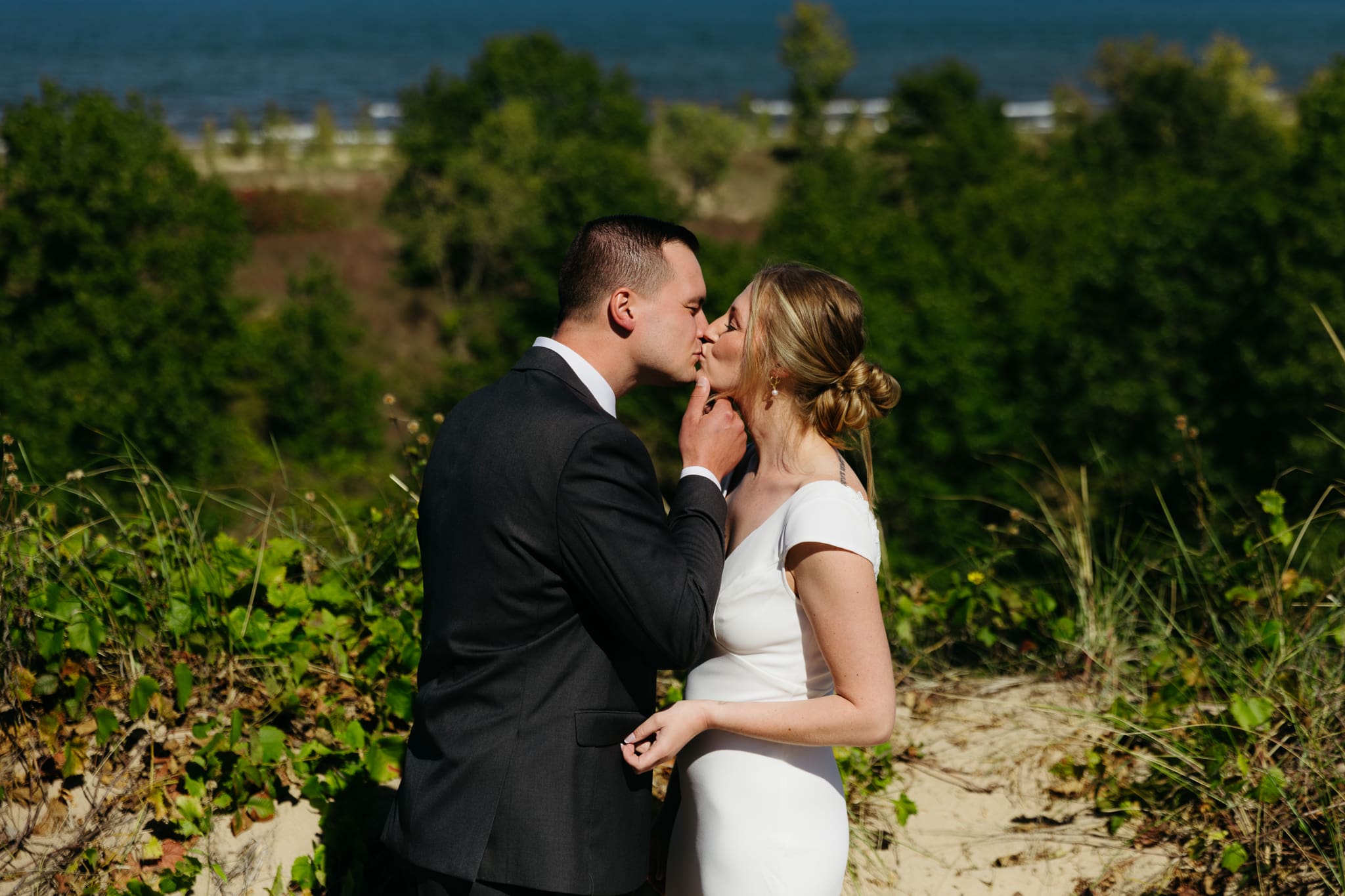Bride and groom explore the dunes of Indiana Dunes National park during their intimate beach wedding