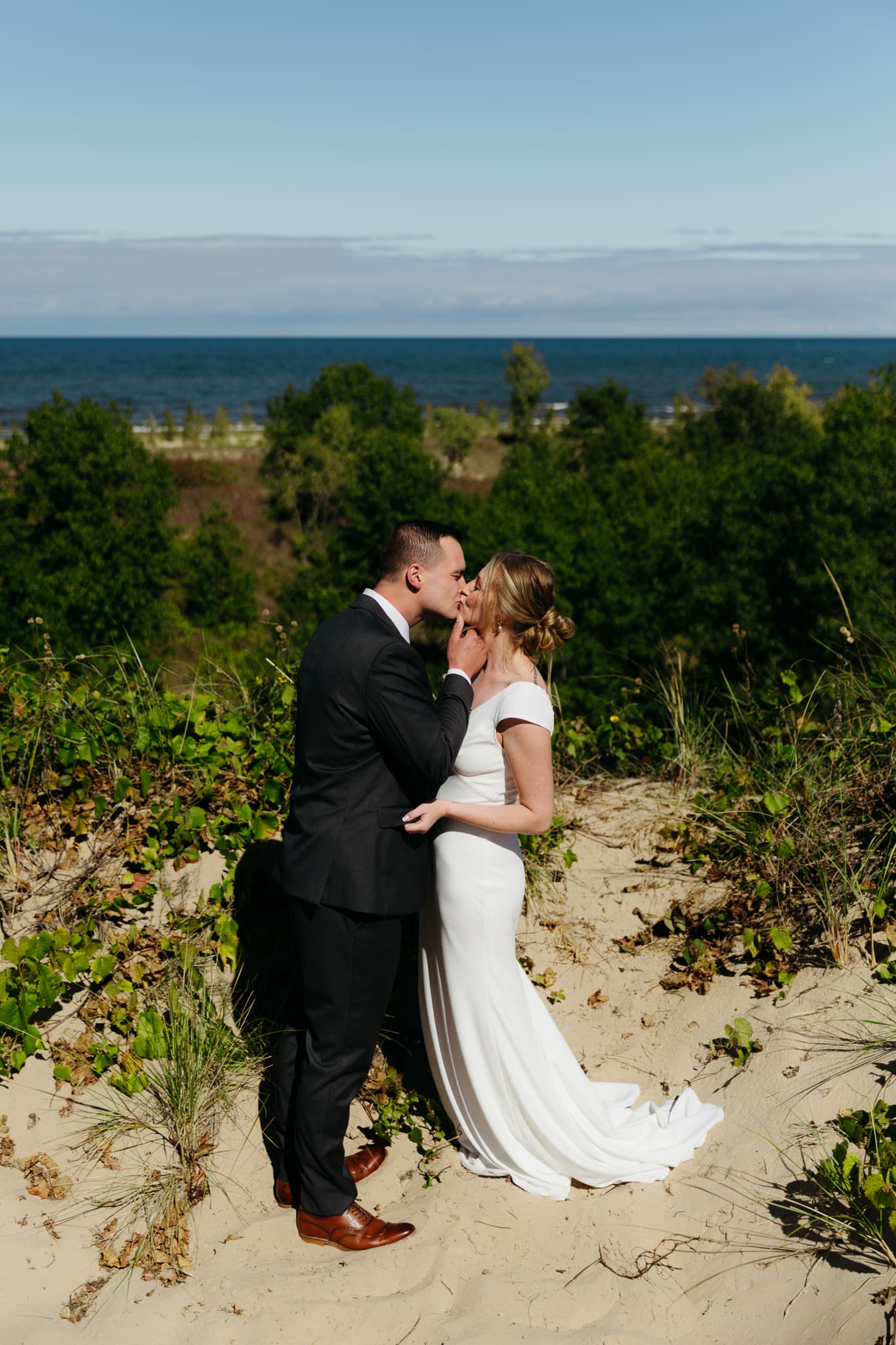 Bride and groom explore the dunes of Indiana Dunes National park during their intimate beach wedding
