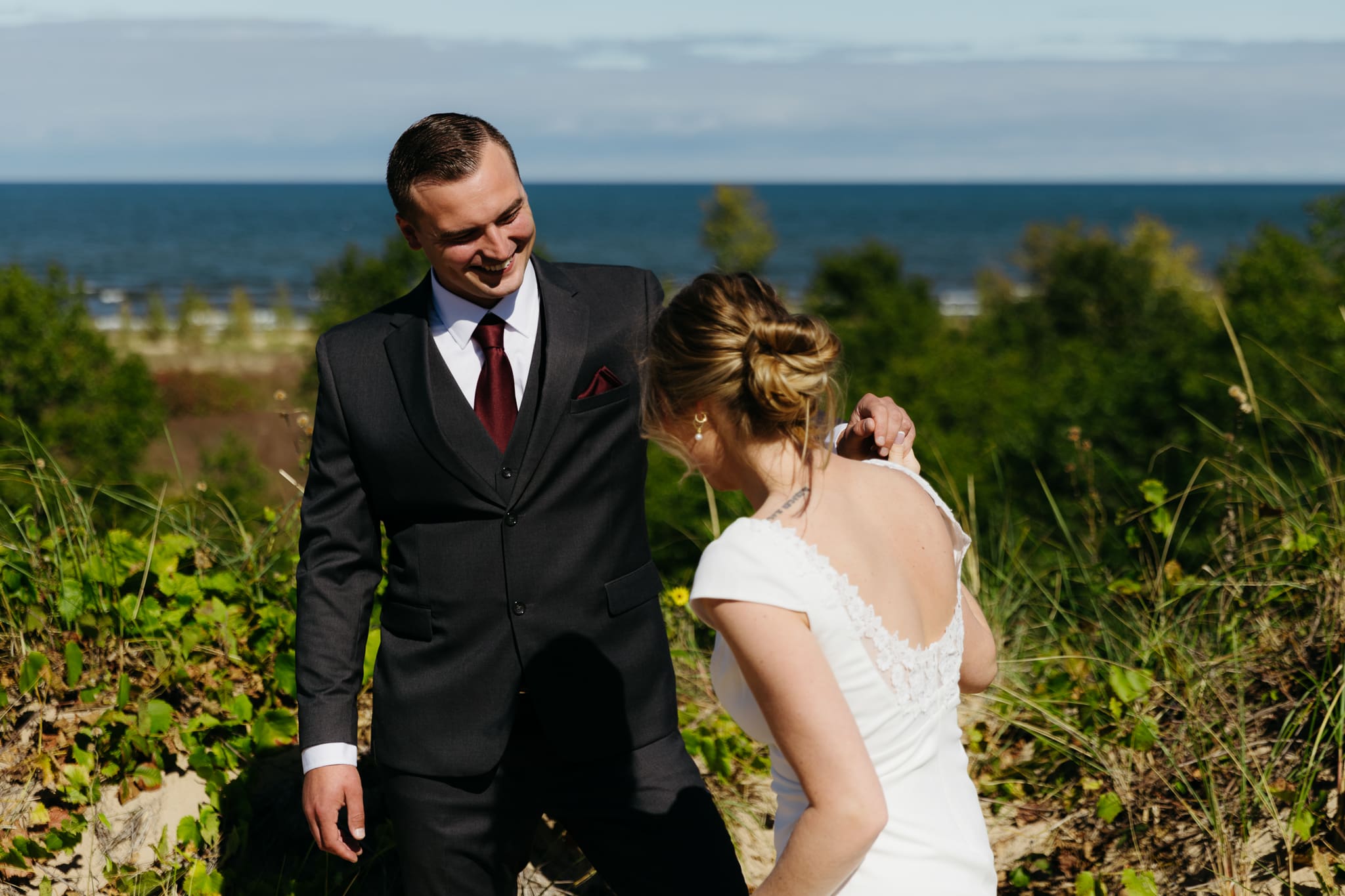 Bride and groom explore the dunes of Indiana Dunes National park during their intimate beach wedding
