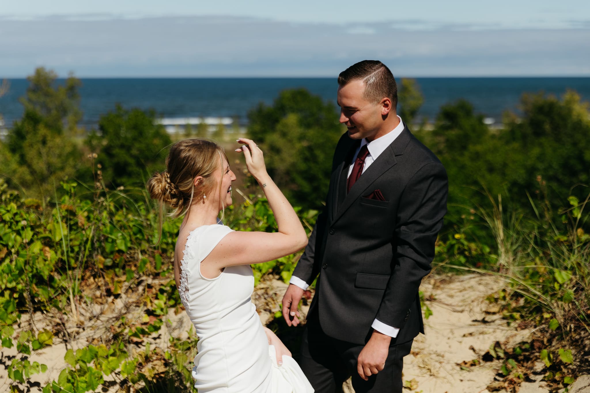 Bride and groom explore the dunes of Indiana Dunes National park during their intimate beach wedding