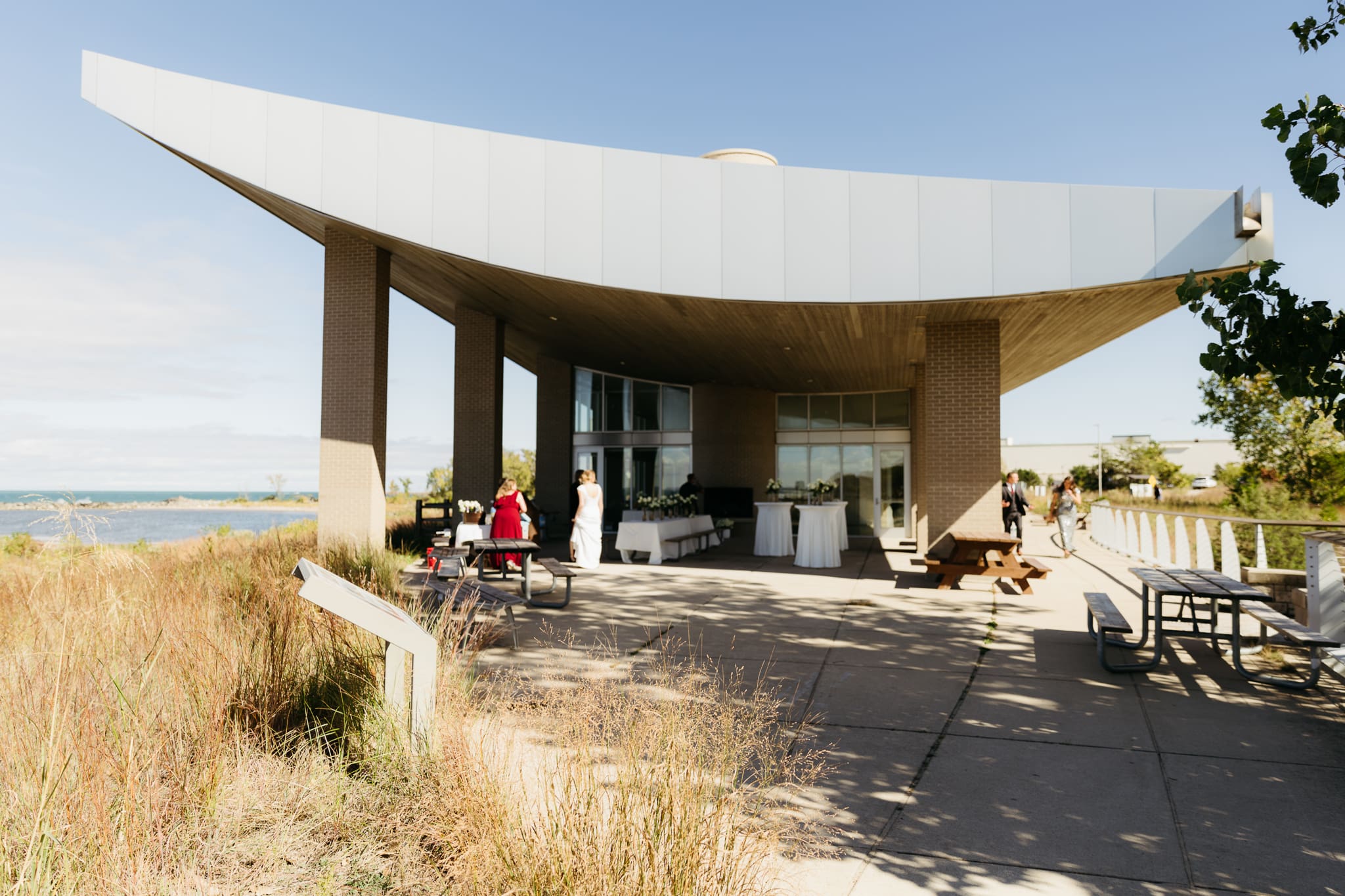 Family and friends set up the Pavilion at Indiana Dunes National Park for a beachside intimate wedding.
