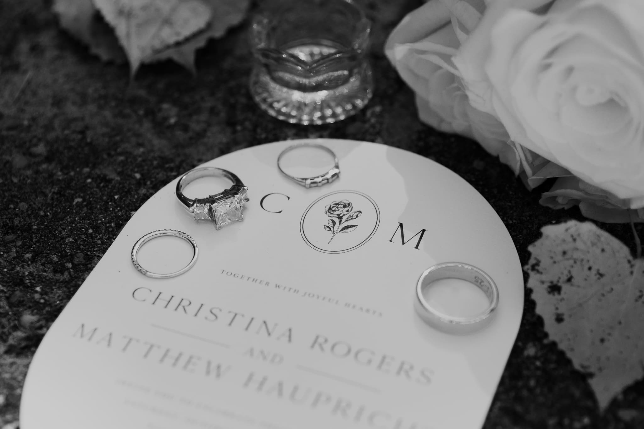 Wedding invitation, rings, and details for an Indiana Dunes intimate wedding along Lake Michigan